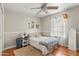 Comfortable bedroom featuring hardwood floors, natural light, and soft textures at 1331 E Bates St, Mesa, AZ 85203