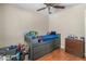 Bedroom with a pull-out bed, neutral walls, wood floor and ceiling fan at 1331 E Bates St, Mesa, AZ 85203