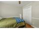 Comfortable bedroom featuring hardwood floors, neutral walls, and a closet at 1331 E Bates St, Mesa, AZ 85203