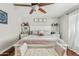 The main bedroom is furnished with an upholstered bench at the foot of the comfortable bed at 1331 E Bates St, Mesa, AZ 85203
