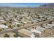 Expansive aerial view of a desert community featuring manufactured homes against a mountain backdrop at 1373 E 23Rd Ave, Apache Junction, AZ 85119