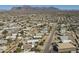 Vast aerial shot featuring a sprawling neighborhood with stunning mountain views in the distance at 1373 E 23Rd Ave, Apache Junction, AZ 85119