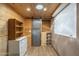 Wood-paneled basement featuring recessed lighting, ample storage, and a large window at 1373 E 23Rd Ave, Apache Junction, AZ 85119