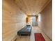 Unique wood-paneled basement with recessed lighting, modern metal sliding door, and comfortable seating at 1373 E 23Rd Ave, Apache Junction, AZ 85119