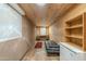 Basement with wood paneled walls, a black futon and storage; ready to be converted into a livable space at 1373 E 23Rd Ave, Apache Junction, AZ 85119