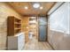 Wood paneled structure showing shelves, dresser, and bathroom with decorative galvanized metal barn door at 1373 E 23Rd Ave, Apache Junction, AZ 85119
