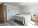 Bright bedroom features stylish flooring, ceiling fan and comfy bedding at 1373 E 23Rd Ave, Apache Junction, AZ 85119