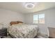 Bright bedroom featuring a comfortable bed, soft lighting, and a window offering natural light at 1373 E 23Rd Ave, Apache Junction, AZ 85119