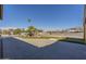 Close up view of the backyard with a large patio and a putting green with mountain views in the background at 1373 E 23Rd Ave, Apache Junction, AZ 85119