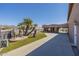 Front exterior of house with xeriscaping and mature palm trees at 1373 E 23Rd Ave, Apache Junction, AZ 85119