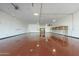 Spacious garage featuring a smooth flooring and a well-lit interior, suitable for storage or projects at 1373 E 23Rd Ave, Apache Junction, AZ 85119