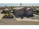 Wide angle of garage, gated yard, block wall and palm trees at 1373 E 23Rd Ave, Apache Junction, AZ 85119