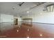 Huge garage featuring smooth floor and wooden shelves. Ready for business or storage at 1373 E 23Rd Ave, Apache Junction, AZ 85119
