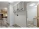 Hallway with overhead storage and easy access to the laundry room and bathroom at 1373 E 23Rd Ave, Apache Junction, AZ 85119