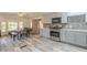 Kitchen features stainless appliances, gray cabinets and mosaic backsplash at 1373 E 23Rd Ave, Apache Junction, AZ 85119