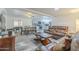 Inviting living room with leather sofas and direct view into kitchen at 1373 E 23Rd Ave, Apache Junction, AZ 85119
