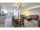 Living room with a ceiling fan and attached kitchen and dining area at 1373 E 23Rd Ave, Apache Junction, AZ 85119