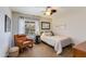 Bedroom featuring a twin bed, rocking chair, and natural light at 15056 N 43Rd St, Phoenix, AZ 85032