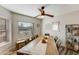Formal dining room featuring a ceiling fan and large window view at 15056 N 43Rd St, Phoenix, AZ 85032