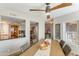 Dining area open to the kitchen featuring a ceiling fan and natural light at 15056 N 43Rd St, Phoenix, AZ 85032