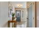 Bright entryway featuring a decorative front door, table and wood look floors at 15056 N 43Rd St, Phoenix, AZ 85032