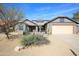 Charming single-story home with desert landscaping, solar panels, and neutral color palette at 15056 N 43Rd St, Phoenix, AZ 85032