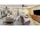 Spacious living room with modern furniture, ceiling fan, and natural light at 15056 N 43Rd St, Phoenix, AZ 85032