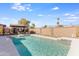 Beautiful backyard pool with desert landscape and a shaded outdoor seating area at 15056 N 43Rd St, Phoenix, AZ 85032