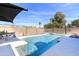 Sparkling pool with blue tile accents surrounded by desert landscaping under sunny skies at 15056 N 43Rd St, Phoenix, AZ 85032
