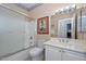 Bathroom with a shower and tub combination, toilet, vanity and mirror at 15779 W Remington Dr, Surprise, AZ 85374