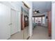 Hallway with closet leading to the bright main bedroom at 15779 W Remington Dr, Surprise, AZ 85374