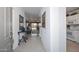 Inviting entryway with tile flooring, elegant decor, and a view into the living spaces at 15779 W Remington Dr, Surprise, AZ 85374