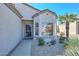 Charming front entrance with a security door, desert landscaping, and a bay window at 15779 W Remington Dr, Surprise, AZ 85374