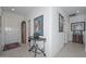 Hallway with tile flooring, neutral walls and views to various rooms in the house at 15779 W Remington Dr, Surprise, AZ 85374