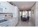 Bright eat-in kitchen with white appliances and a charming breakfast nook at 15779 W Remington Dr, Surprise, AZ 85374