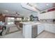 Bright kitchen with stainless steel dishwasher and an open-concept floor plan at 15779 W Remington Dr, Surprise, AZ 85374