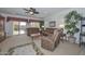 Inviting living room features comfortable seating and sliding glass doors to the backyard at 15779 W Remington Dr, Surprise, AZ 85374