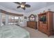 Comfortable main bedroom showcasing the furnishings and natural light at 15779 W Remington Dr, Surprise, AZ 85374