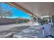 Backyard patio area with gravel landscaping, tables, and view of block wall at 15779 W Remington Dr, Surprise, AZ 85374