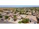 High-angle aerial view displaying a cluster of houses with desert landscaping and neighborhood streets at 16188 W Hearn Rd, Surprise, AZ 85379