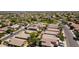 Extensive aerial view showing rows of houses in a well-planned community with common green spaces at 16188 W Hearn Rd, Surprise, AZ 85379