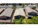 Aerial shot of backyard featuring green lawn, desert landscaping, and a covered patio at 16188 W Hearn Rd, Surprise, AZ 85379