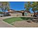 Picture-perfect front yard, showcasing a home with an attached garage and desert landscaping at 16188 W Hearn Rd, Surprise, AZ 85379