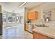 Bright kitchen featuring a breakfast bar, stainless steel appliances, and a view to the adjacent breakfast nook at 16188 W Hearn Rd, Surprise, AZ 85379