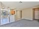 Open-concept space showing living room flowing into the kitchen with breakfast bar at 16188 W Hearn Rd, Surprise, AZ 85379