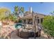 An outdoor living space featuring a pool, spa, and fire pit area, perfect for entertaining guests at 16256 S 1St St, Phoenix, AZ 85048