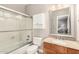 Bathroom with a shower-tub combo, cabinet storage, and a vanity with granite countertop at 16256 S 1St St, Phoenix, AZ 85048