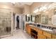 Bathroom featuring double sinks with granite counters, vanity, tiled floor, and glass shower enclosure at 16256 S 1St St, Phoenix, AZ 85048