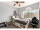 Well-lit bedroom showcasing a bed, large window, and a dedicated workspace at 16256 S 1St St, Phoenix, AZ 85048