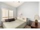Comfortable bedroom with a bed and nice window shutters at 16256 S 1St St, Phoenix, AZ 85048